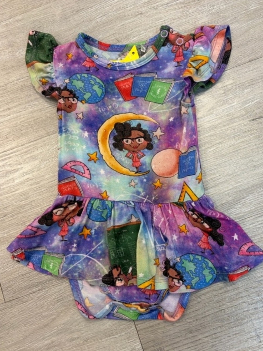 Posh Peanut Purple Space & Schoolbook Ruffle One-Piece Bamboo Bodysuit